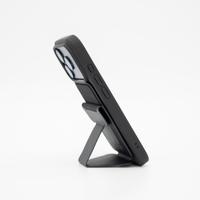 Side profile of the Peel Magnetic Wallet Stand with the stand folded out to support an iPhone